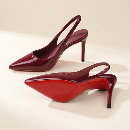 The Margaux slingback heel in Bordeaux, one heel on its side showing the full sole