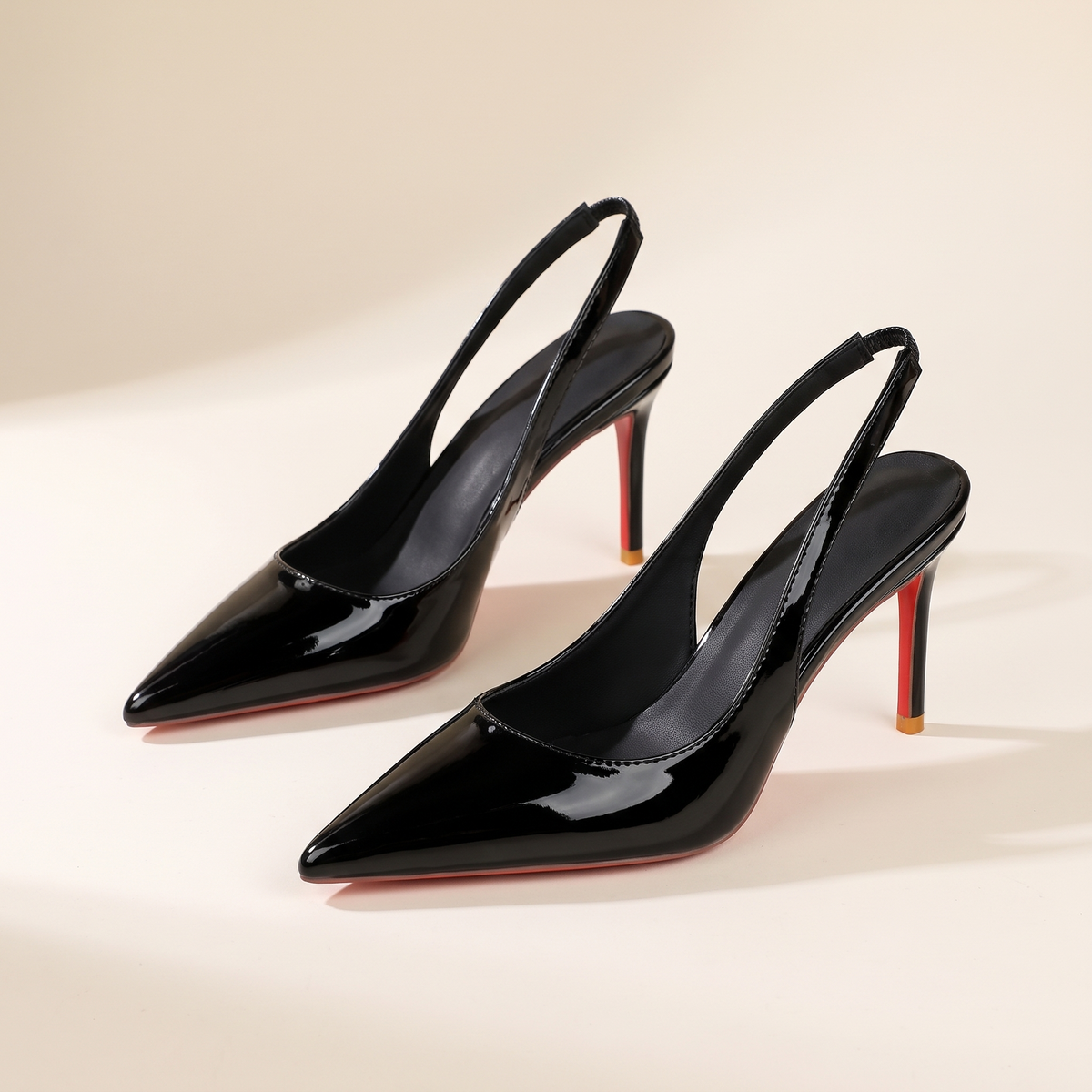 The Margaux slingback heel in Noir, pair, three-quarter view